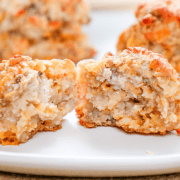 Golden baked chicken meatballs with crispy coating on white plate, homemade savory comfort food, baking beauty.