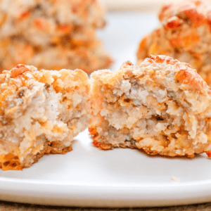Golden baked chicken meatballs with crispy coating on white plate, homemade savory comfort food, baking beauty.