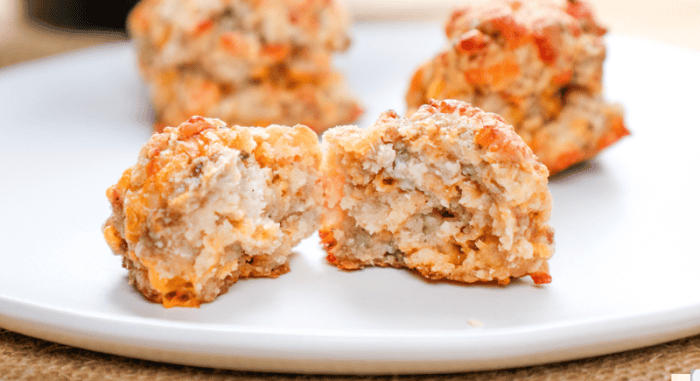 Golden baked chicken meatballs with crispy coating on white plate, homemade savory comfort food, baking beauty.