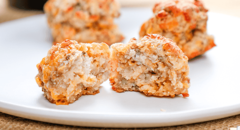 Golden baked chicken meatballs with crispy coating on white plate, homemade savory comfort food, baking beauty.