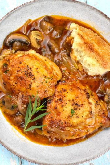 Chicken Chasseur, or Hunter's Chicken, is a delightful French dish where chicken braises in a wine and herb infused brown sauce.