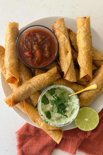Air fryer chicken taquitos on a plate.