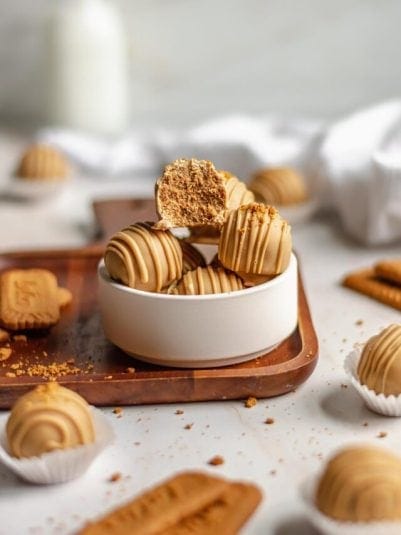 A pile of Biscoff Truffles in a white bowl.