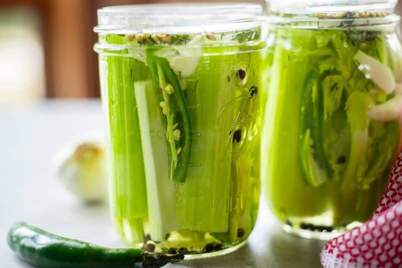 Two jars with pickled celery.