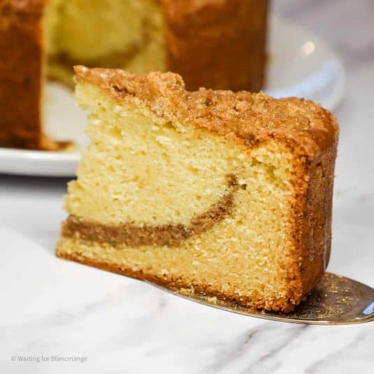 Slice of almond streusel coffee cake.