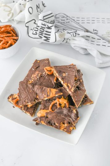 A white plate of a no bake salty sweet dessert.