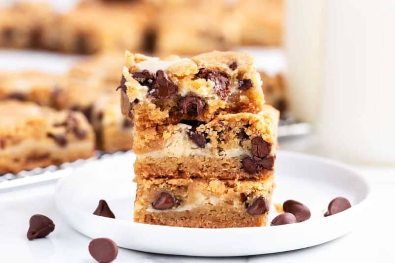 stack of cookie bars on white plate.