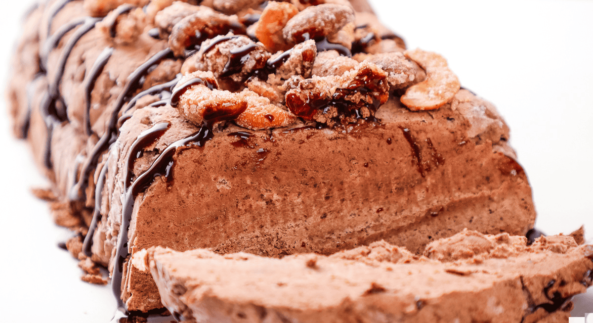 a chocolate semifreddo with one slice cut out of it.