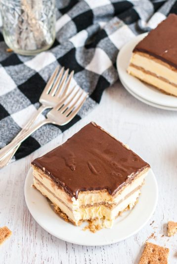 A slice of bitten eclair cake on a plate.