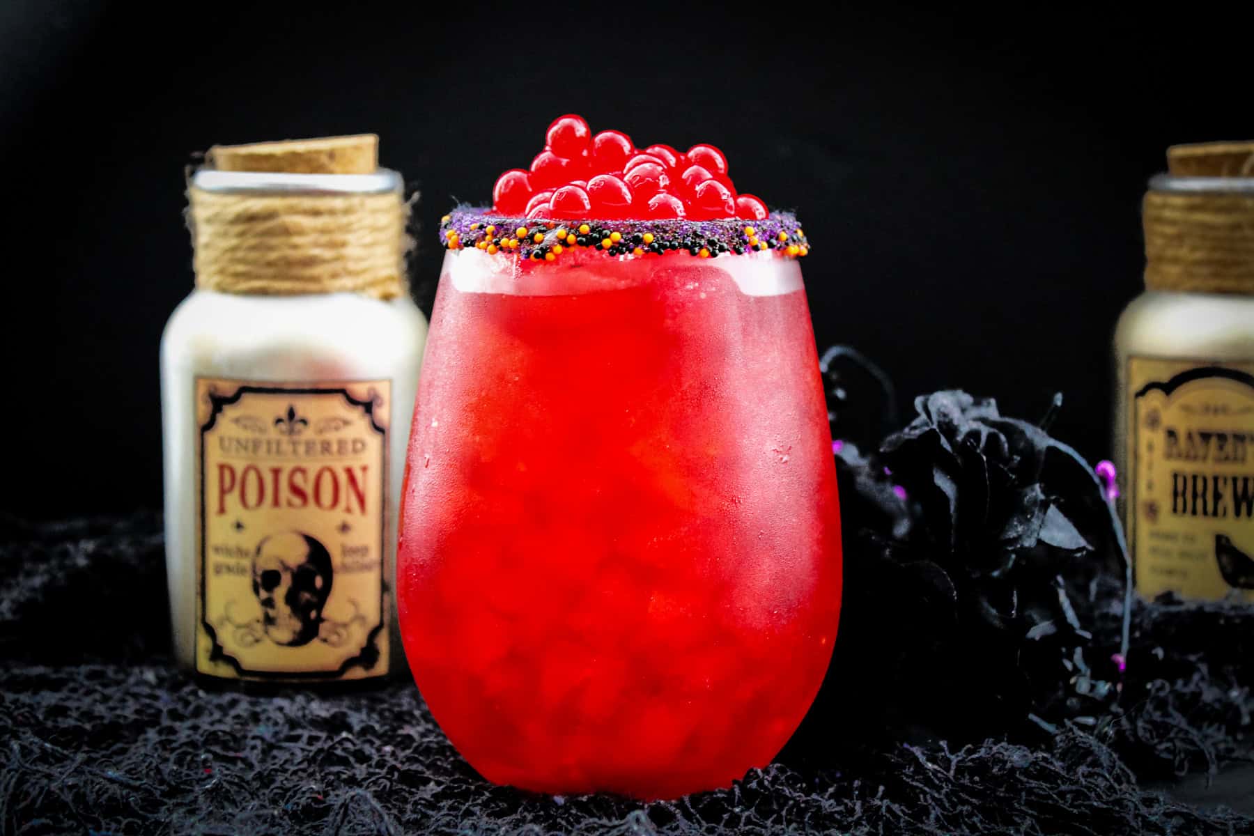 a red fireball cocktail with cherry boba.