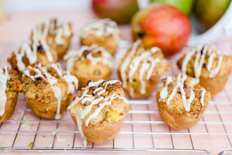 Mango Muffins with Maple Walnut Streusel on a rack.
