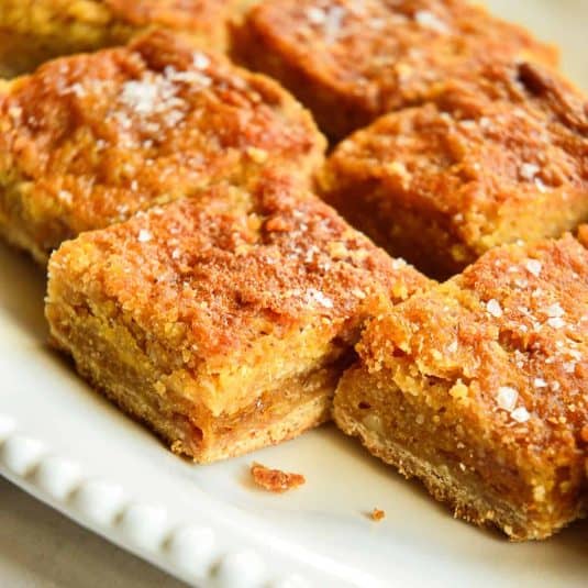 individual salted honey bars on white plate.