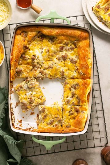 Crescent Roll Breakfast Casserole in a baking dish, some cut into squares.
