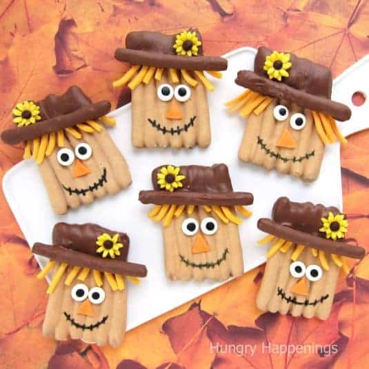 Scarecrow pretzels dipped with chocolate and peanut butter coating.