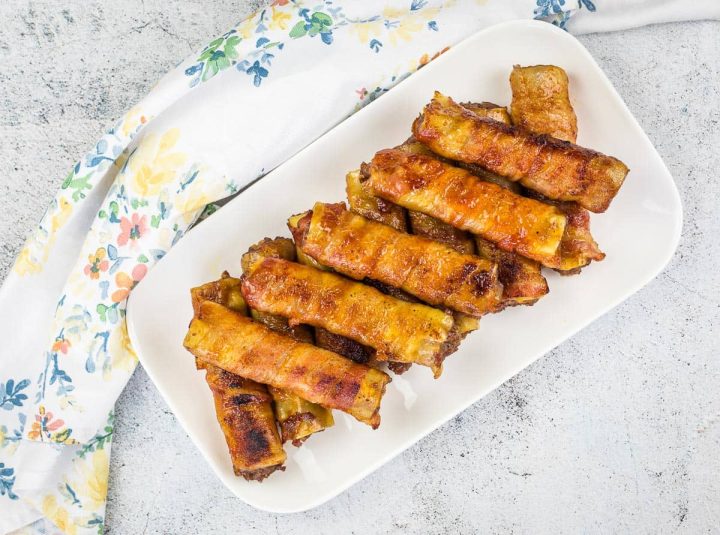 Smoked Chicken Legs with Red Pepper Glaze on a round platter.