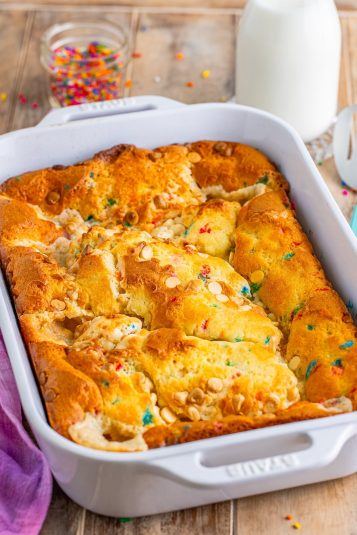Colorful cookie dough and cereal casserole baked in a white dish for easy homemade dessert or breakfast.
