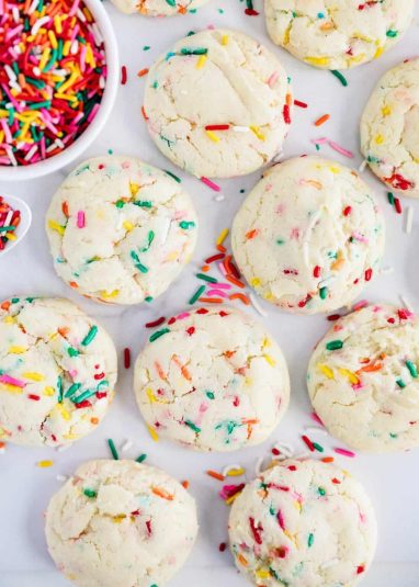 Colorful sprinkle cookies with creamy frosting and vibrant sprinkles, perfect for celebration treats.