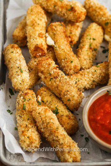 Baked Air Fryer Mozzarella Sticks on a table.
