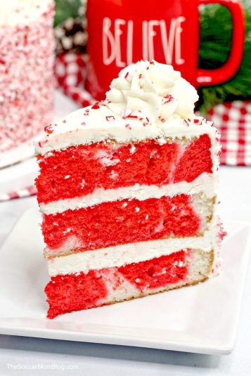 Slice of red and white peppermint layer cake.