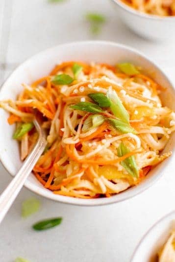 Delicious vegetable stir-fry with carrots, cabbage, and scallions, perfect for healthy meals and quick cooking.