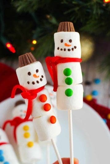 Snowman marshmallow treats on sticks.
