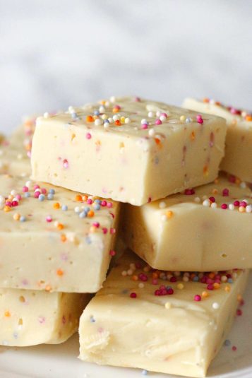 Creamy white chocolate fudge with colorful sprinkles, perfect for baking and dessert recipes.