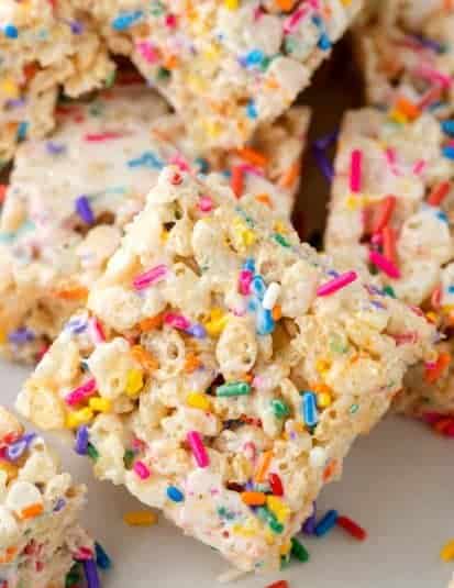Colorful Rice Krispies treats with rainbow sprinkles, perfect for festive celebrations and sweet snacking.