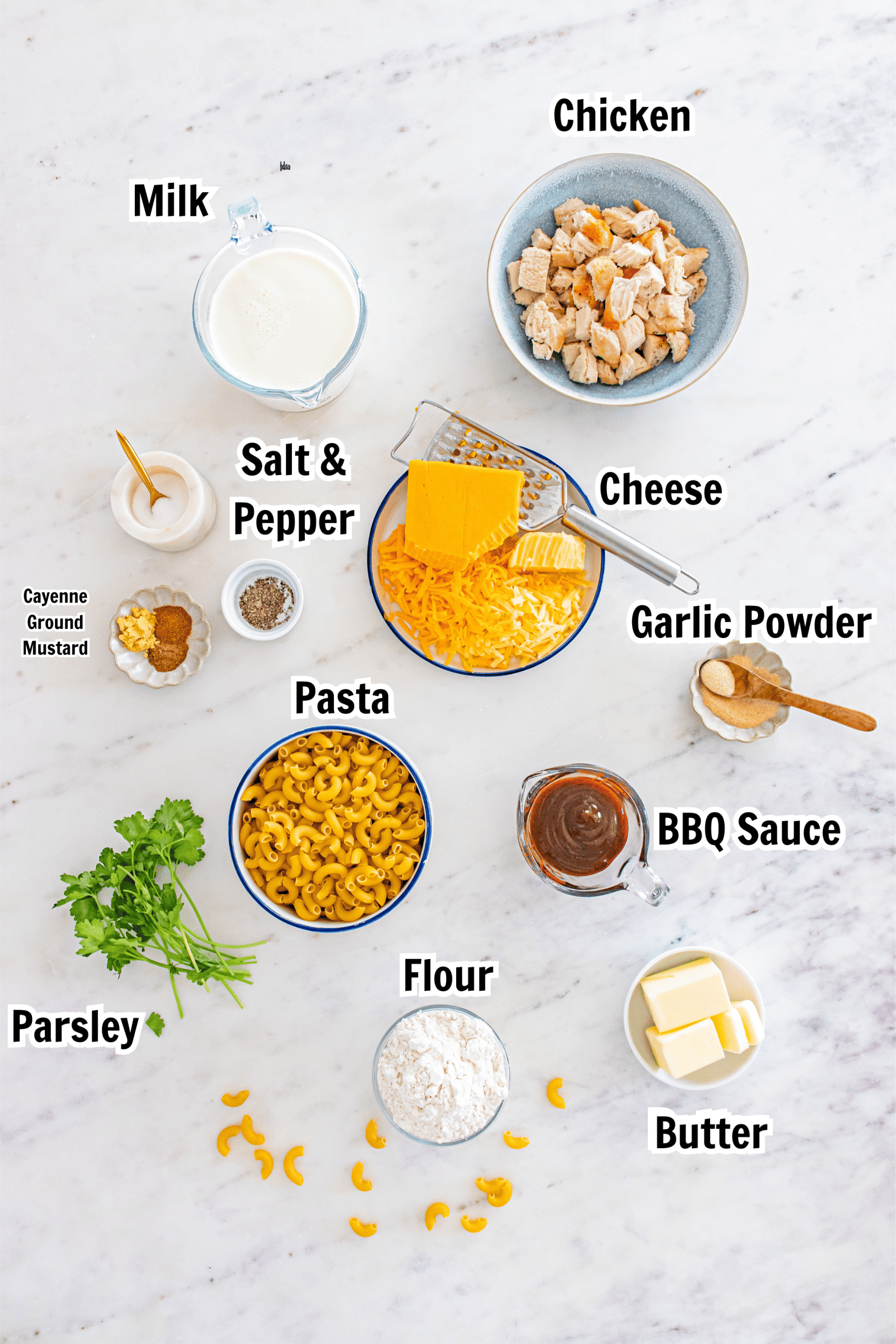 ingredients including elbow macaroni, butter, flour, bbq sauce, garlic powder, cheese, milk, chicken, and BBQ sauce.