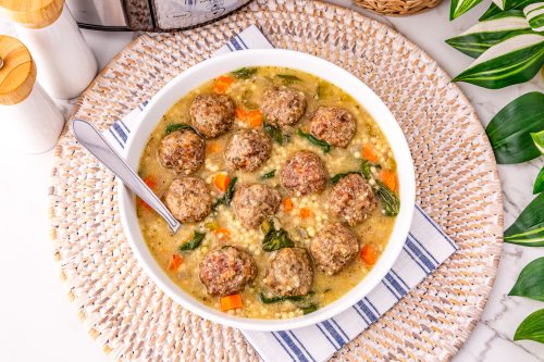 Savory meatball soup with vegetables in a creamy broth, perfect for cozy family dinners.