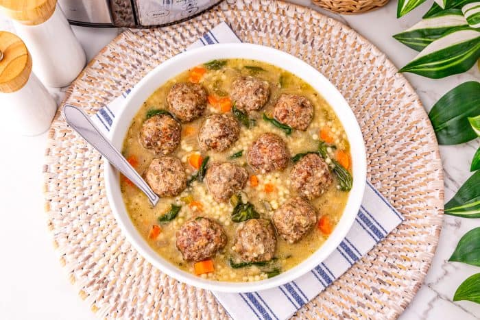Savory meatball soup with vegetables in a creamy broth, perfect for cozy family dinners.