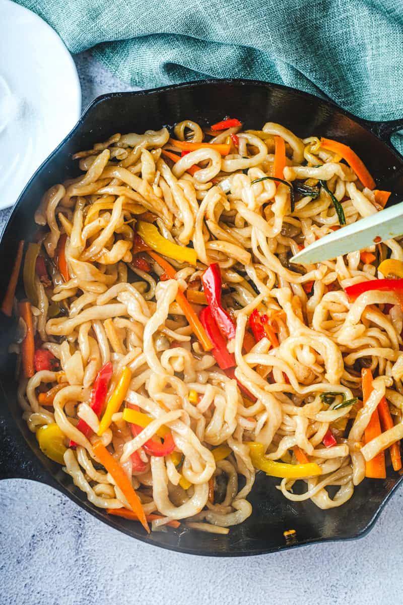 a skillet of vegetarian yaki udon. 