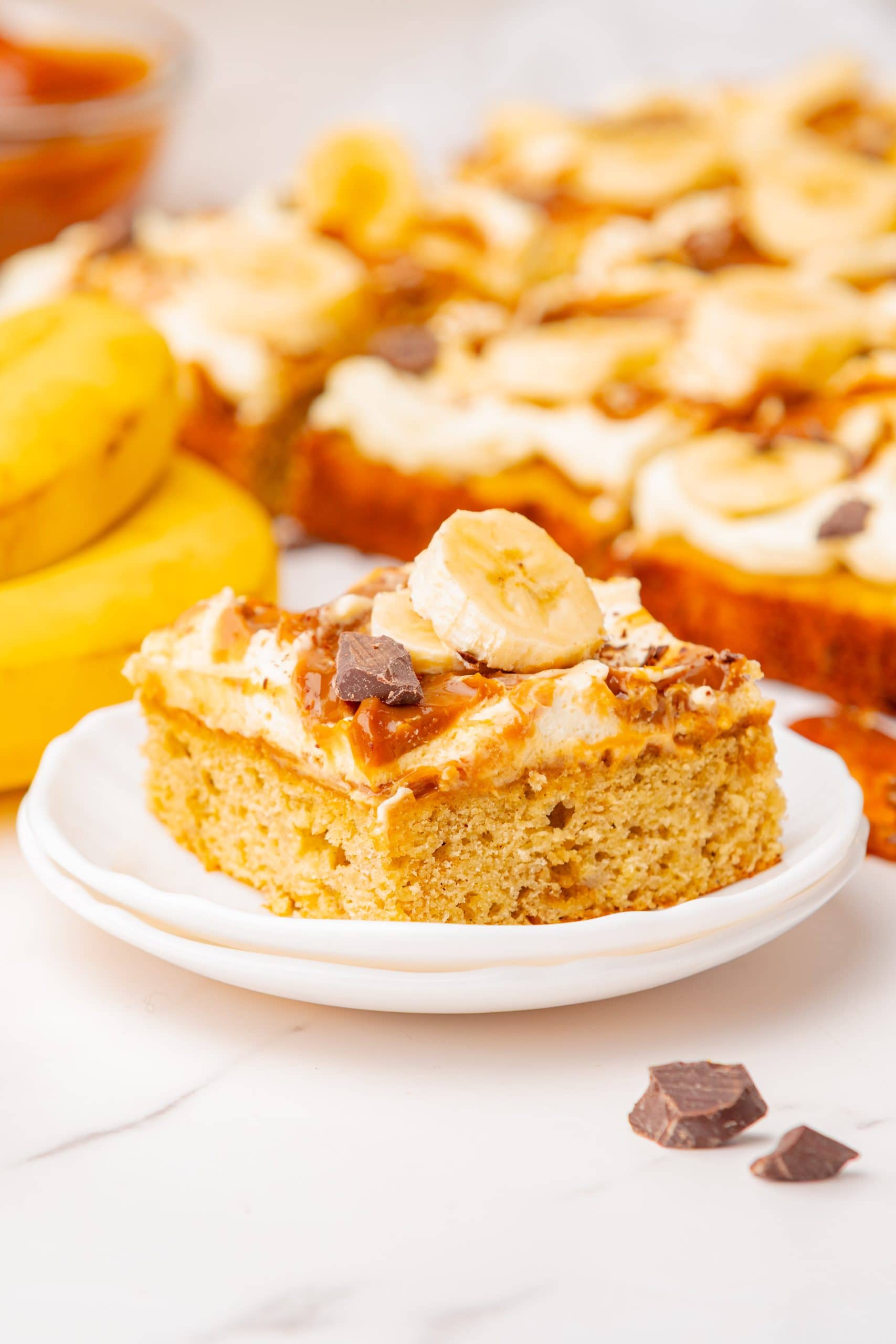 a slice of banoffee cake on a white plate.