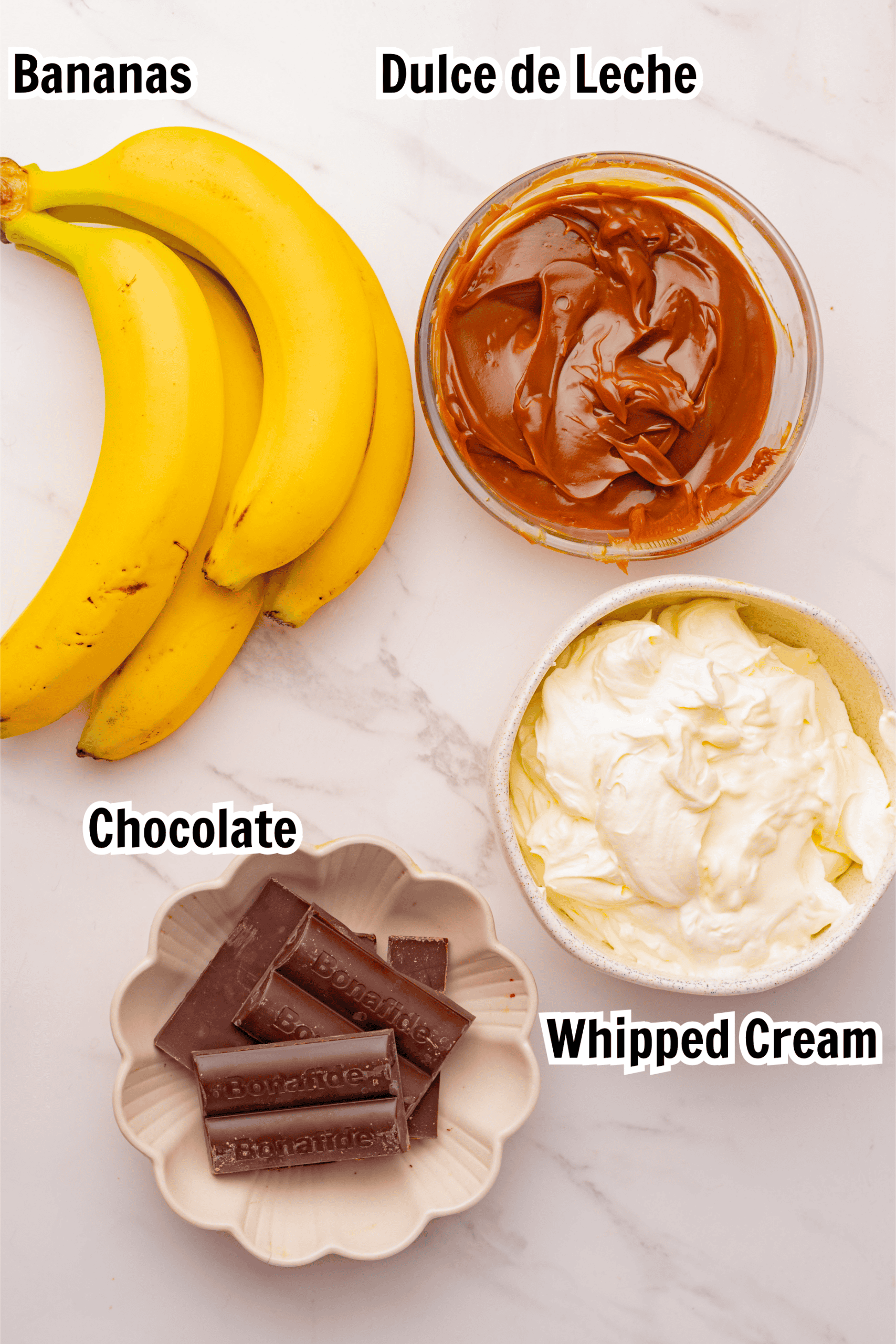 ingredients including bananas, dulce de leche, whipped cream, and chocolate. 