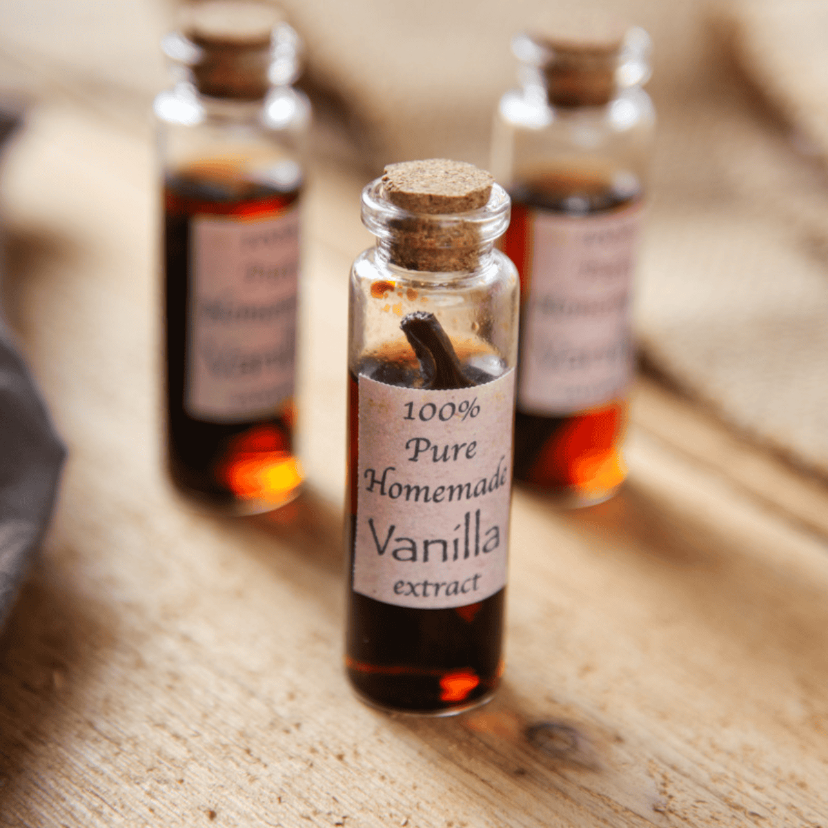 3 bottles of homemade vanilla extract made with vodka.