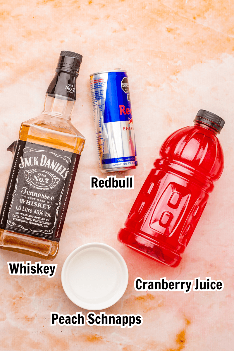 ingredients including Jack Daniel's whiskey, a can of Red Bull, peach schnapps, and cranberry juice.