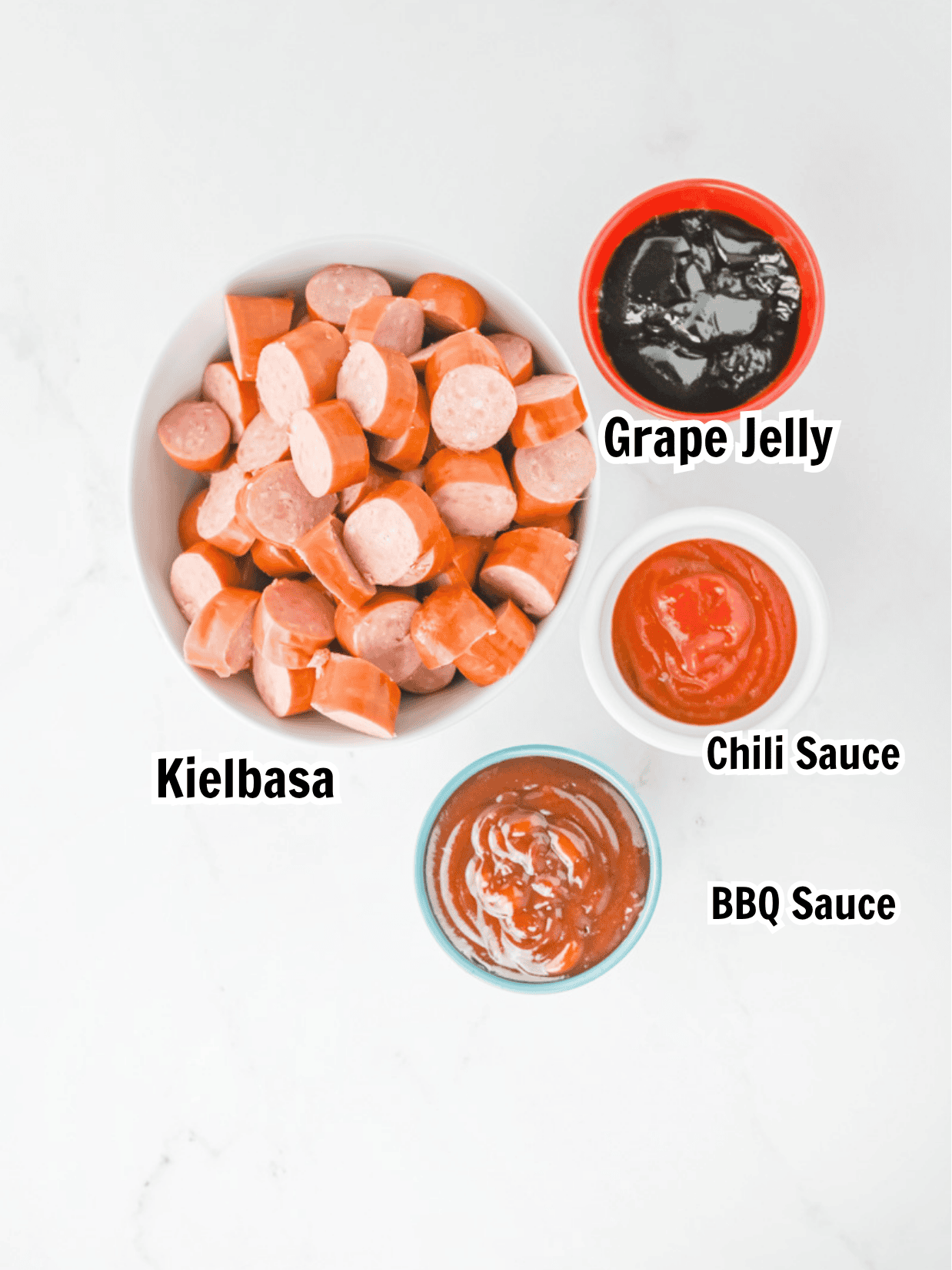 ingredients including kielbasa cut into coins, grape jelly, chili sauce and BBQ sauce.