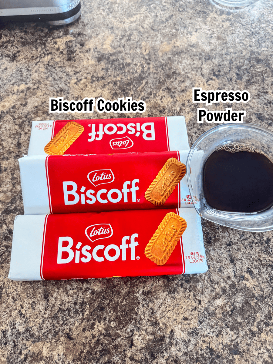 3 packs of Lotus Biscoff cookies and brewed espresso in a glass measuring cup.
