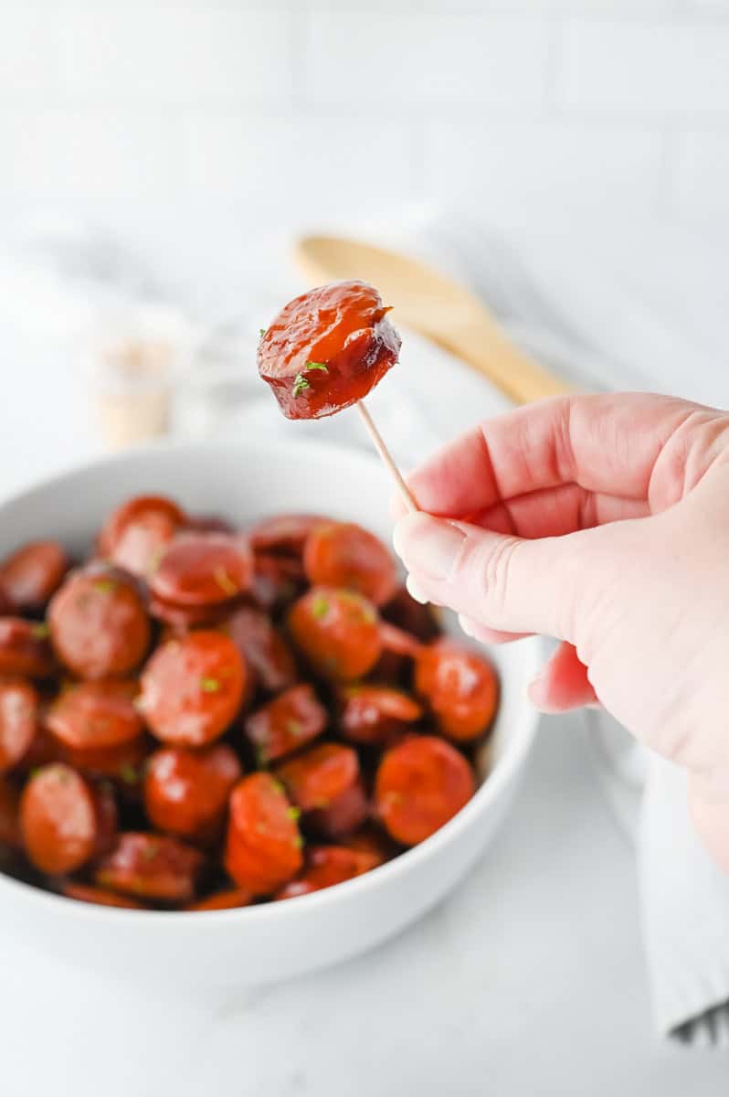 a BBQ kielbasa bite on a toothpick. 