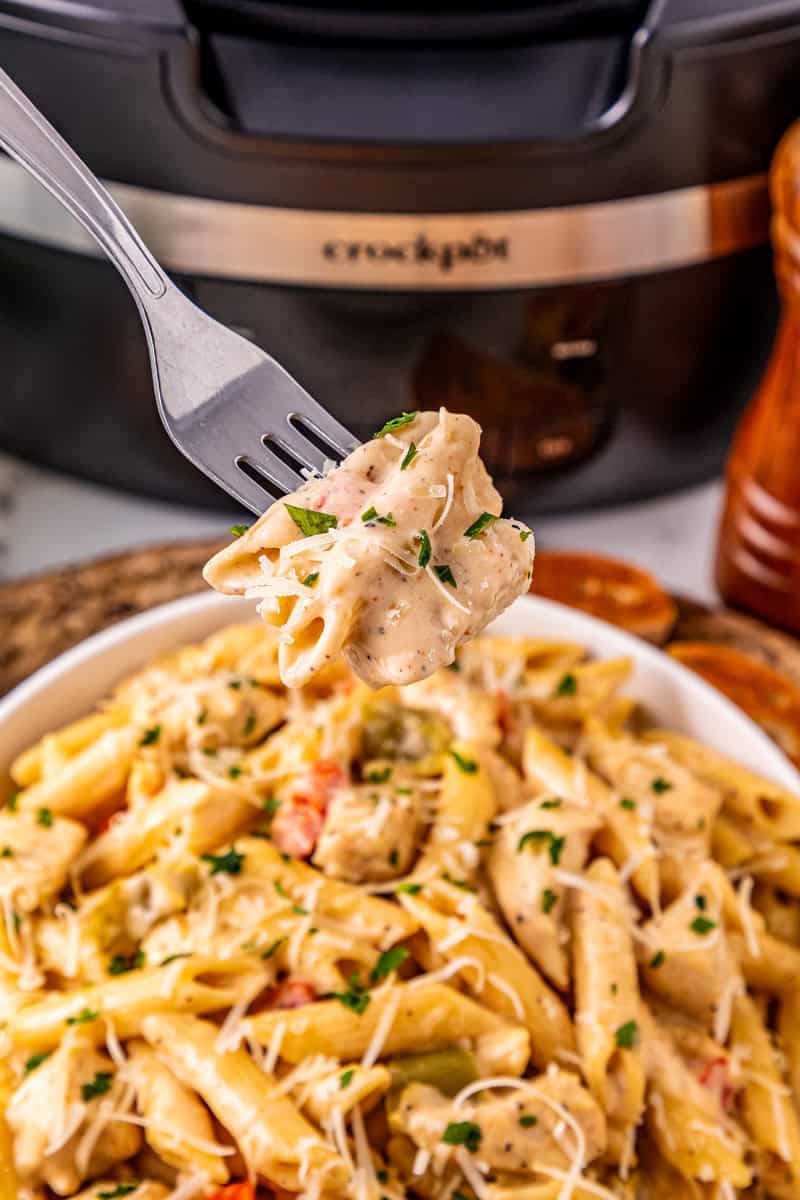 a forkful of Cajun pasta with chicken.