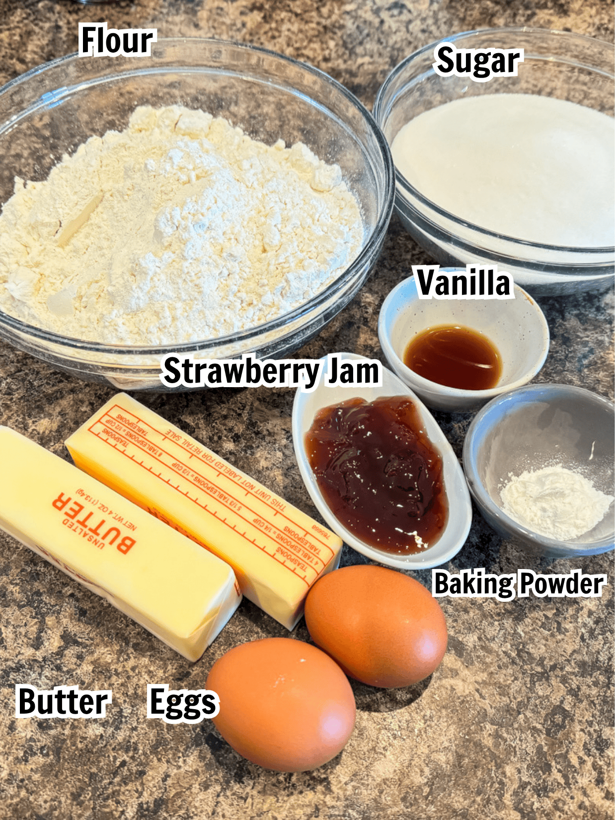 ingredients including flour, sugar, butter, eggs, baking powder, strawberry jam, vanilla. 