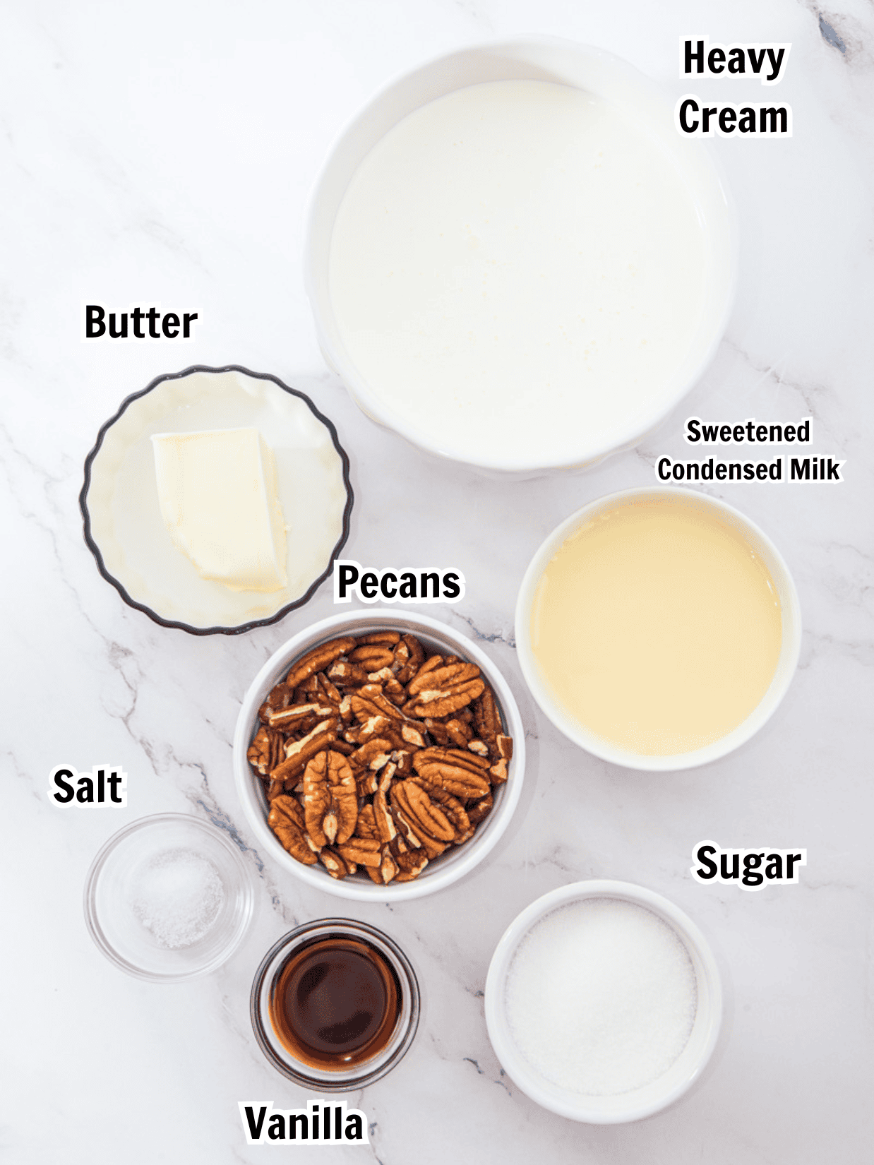 ingredients including heavy cream, butter, sweetened condensed milk, pecans, sugar, vanilla and salt. 