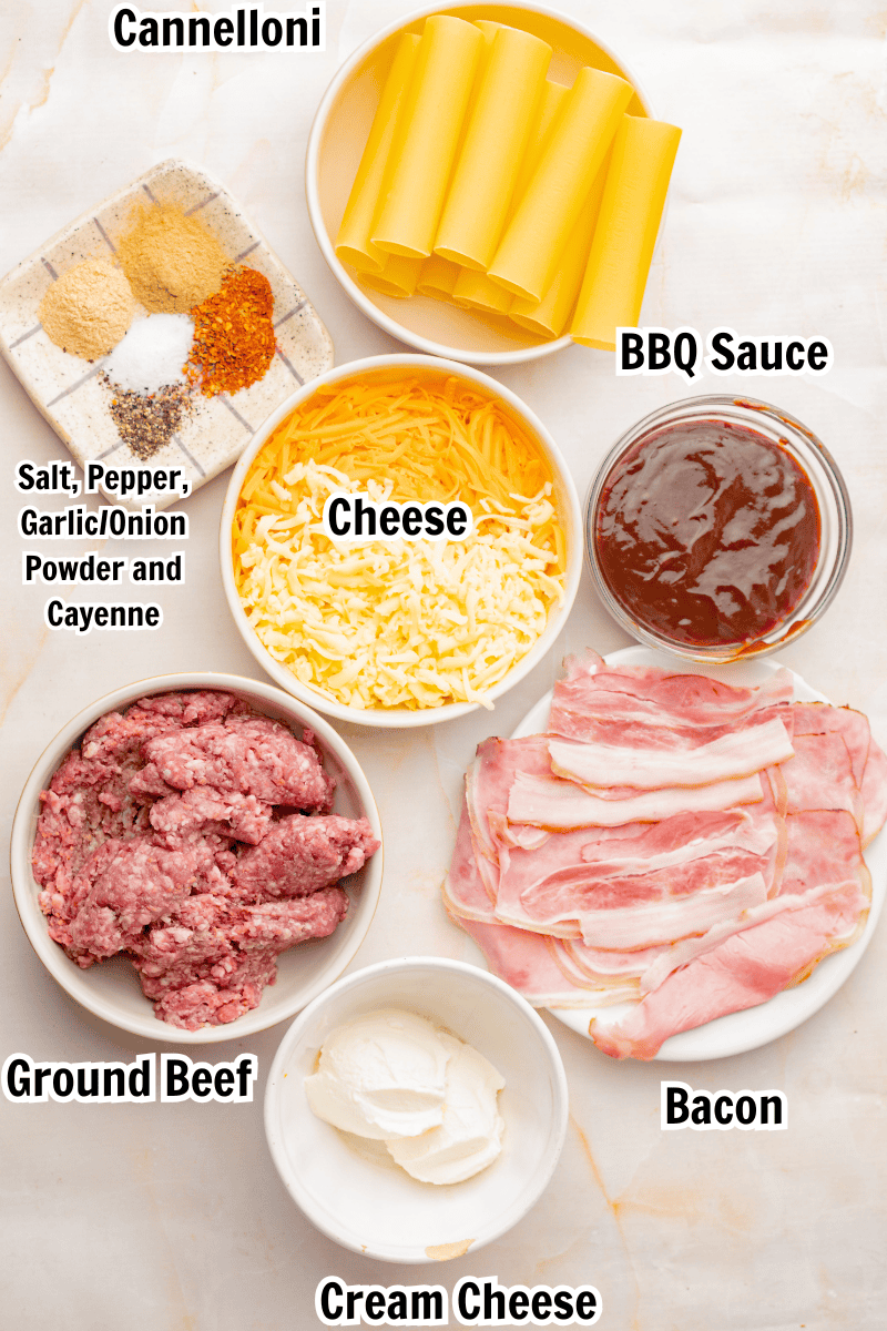 ingredients including cannelloni pasta, bbq sauce, cheese, ground beef, bacon, cream cheese, and spices. 