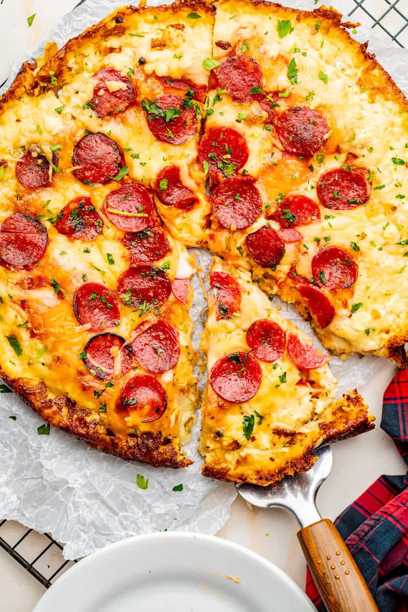 a cheese and pepperoni pizza with a crispy cheese crust.