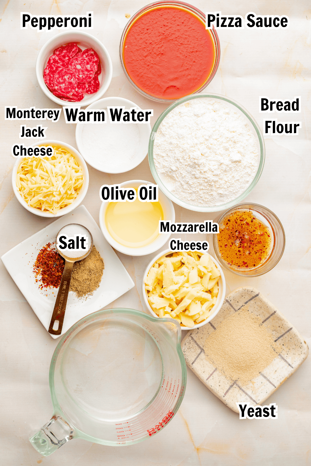 ingredients including bread flour, olive oil, yeast, cheese, pepperoni, and salt.