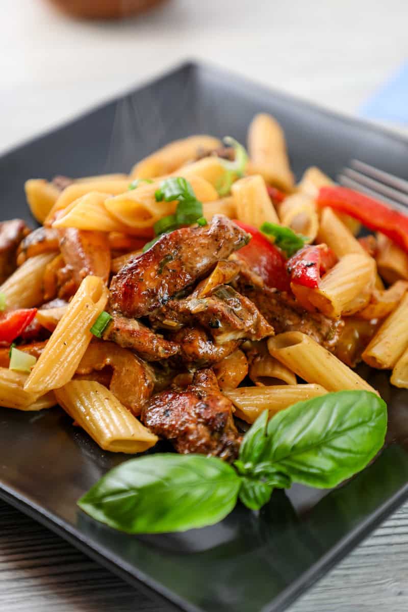rasta pasta with penne noodles, jerk chicken, bell peppers, and a creamy spicy sauce.