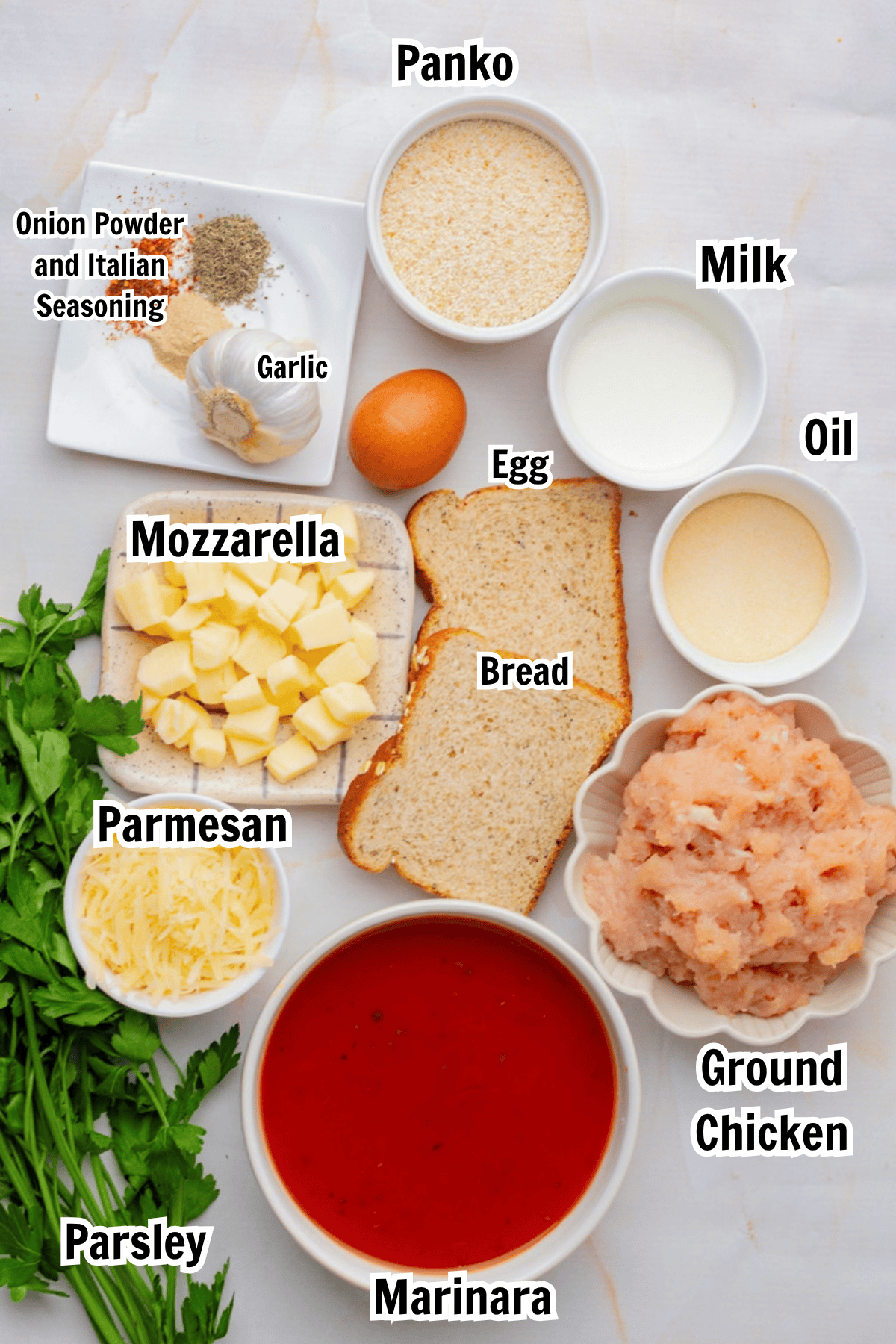 ingredients including ground chicken, mozzarella, parmesan, panko, milk, oil, garlic, parsley, egg, and marinara sauce.