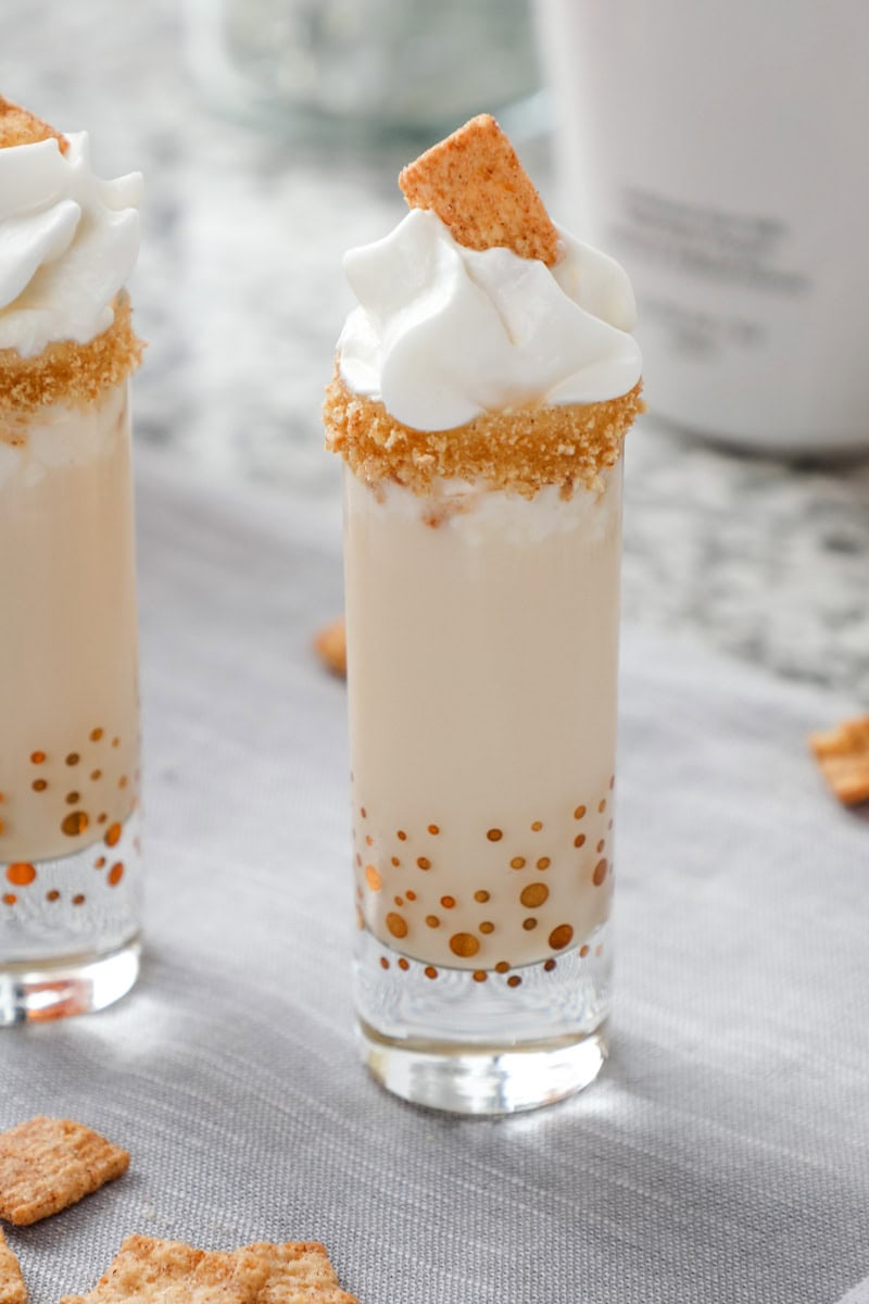 a closeup of a cinnamon toast crunch shot with whipped cream.